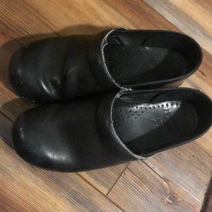 Dansko black leather clogs